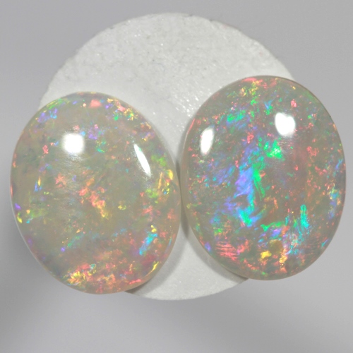 SOLID SEMI BLACK OPALS Matching pair, bright multicolours